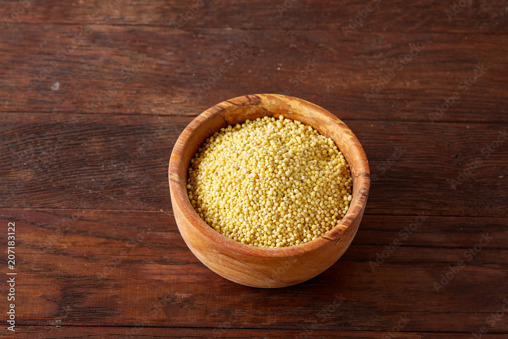 Lentils in a wooden bowl on rustic wooden background, top view, close-up, selective focus. Lentils in a wooden bowl on rustic wooden background, top view, close-up, selective focus.