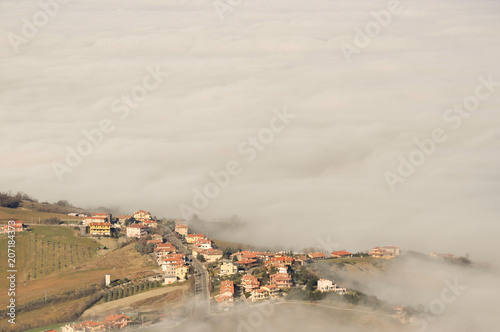 Landscape of nature in the fog of  San Marino country in Italy