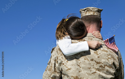 Military Man Hugging His Daughter