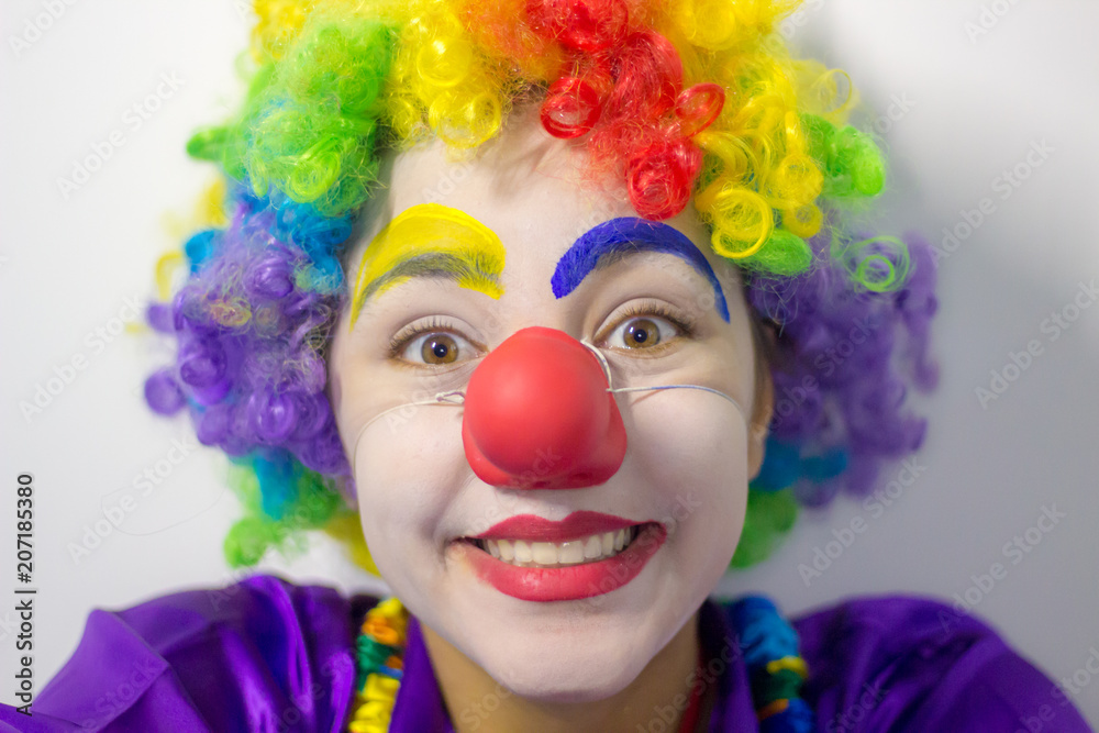 Portrait of happy funny clown girl