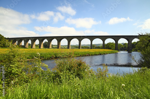 Arthington to castley railway viaduct spanning the river wharfe in leeds west yorkshire on a sunny spring day photo