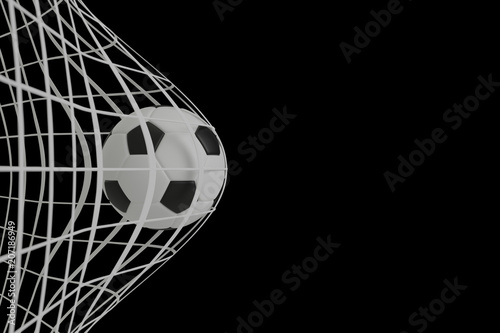 Football in net on black background