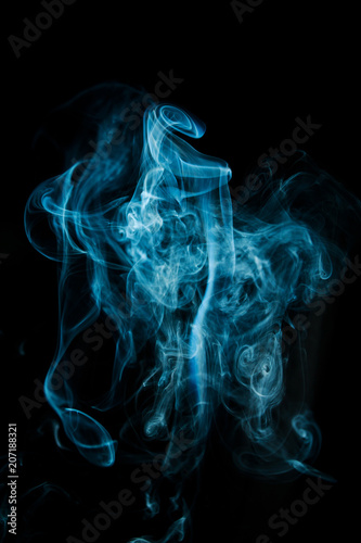 Abstract blue smoke isolated on black background