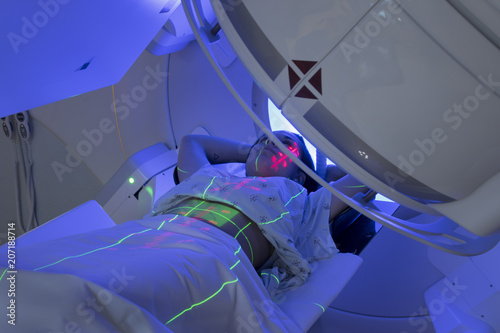 Woman Receiving Radiation Therapy/ Radiotherapy Treatments for Cancer  photo