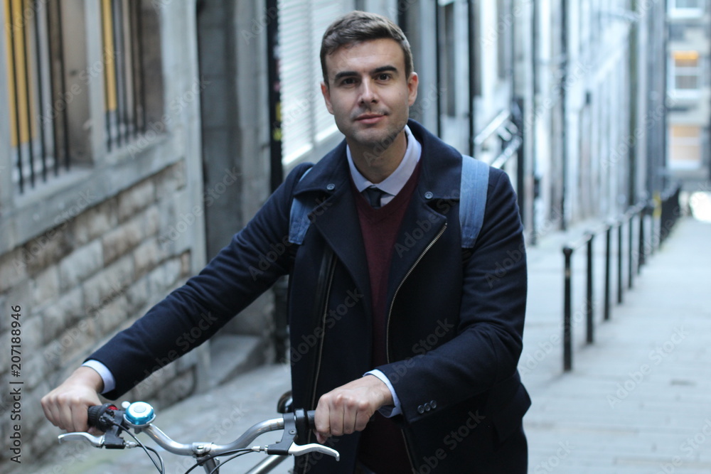 Classic looking man carrying bicycle upstairs Classic looking man carrying bicycle upstairs