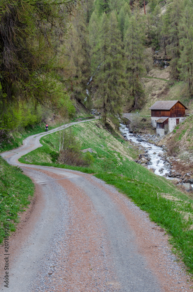 Small road through mountain terrain in Switzerland