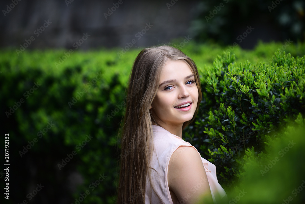 sensual model with makeup after hairdresser. Sexy woman with long hair in summer park. Summer or spring fashion and beauty. look of girl near green plants. girl in casual clothes outdoor sensual model with makeup after hairdresser. Sexy woman with long hair in summer park. Summer or spring fashion and beauty. look of girl near green plants. girl in casual clothes outdoor
