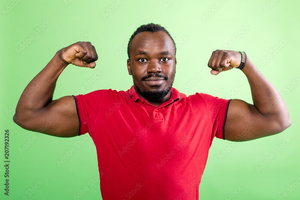 African shows muscles on his hands African shows muscles on his hands