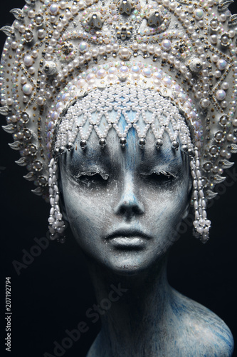 Head of mannequin in creative white metal kokoshnick with pearls