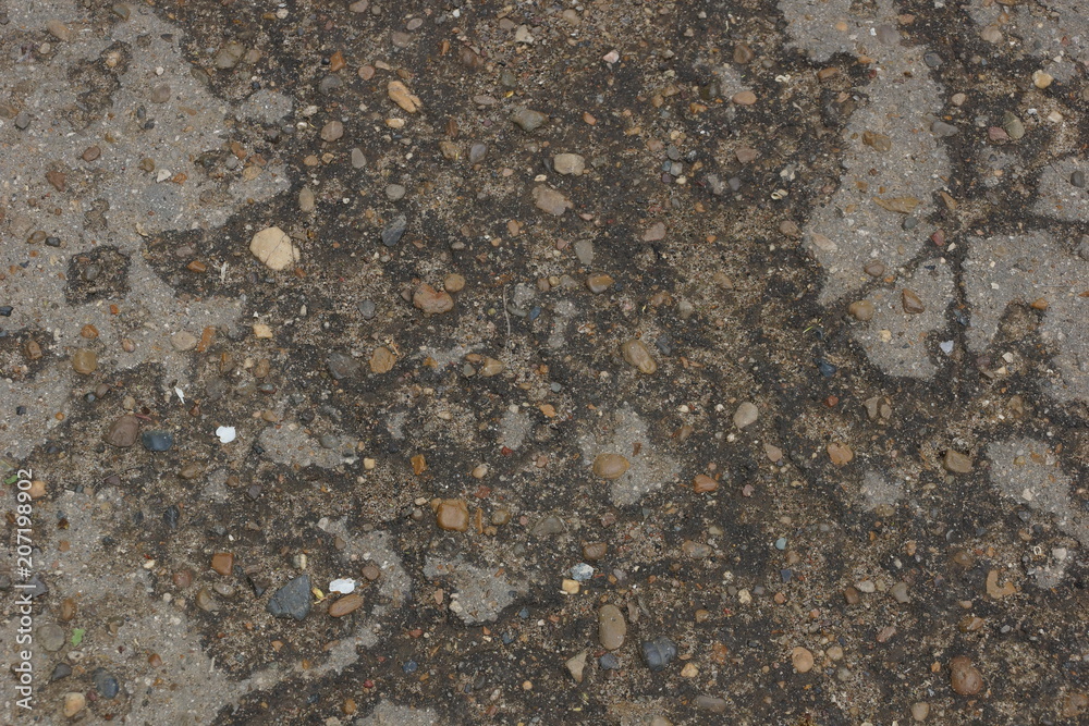 the texture of the old asphalt. small pebbles crack grunge the texture of the old asphalt. small pebbles crack grunge