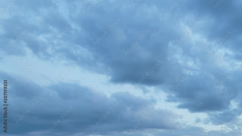 Russia, time lapse. Formation and rapid movement of white clouds of different shapes in the blue sky in late spring at sunset. Russia, time lapse. Formation and rapid movement of white clouds of different shapes in the blue sky in late spring at sunset.