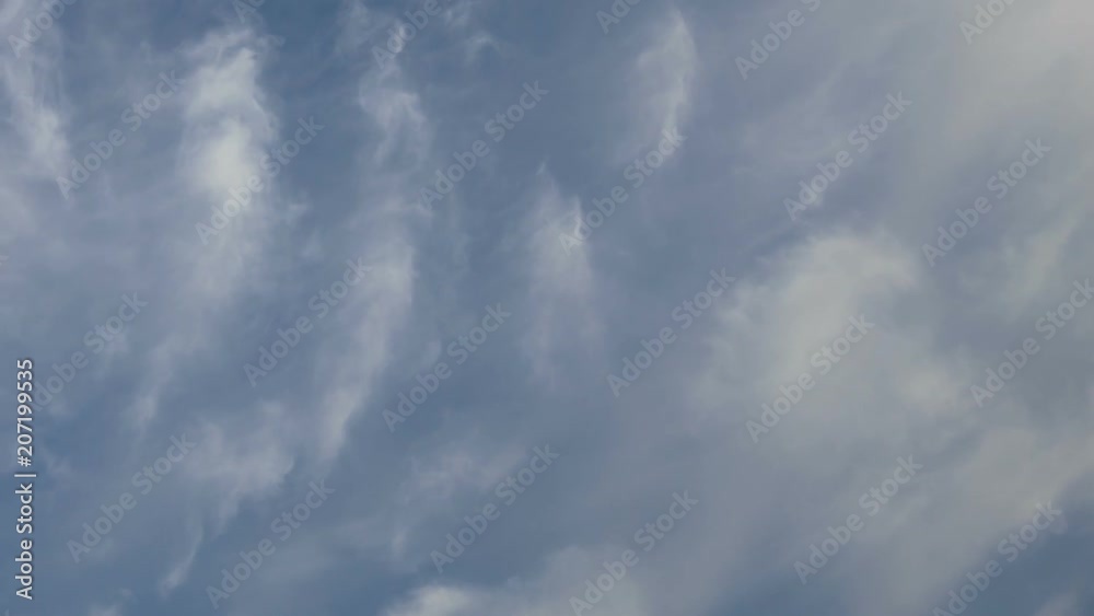 Russia, time lapse. Formation and rapid movement of white clouds of different shapes in the blue sky in late spring at sunset. Russia, time lapse. Formation and rapid movement of white clouds of different shapes in the blue sky in late spring at sunset.