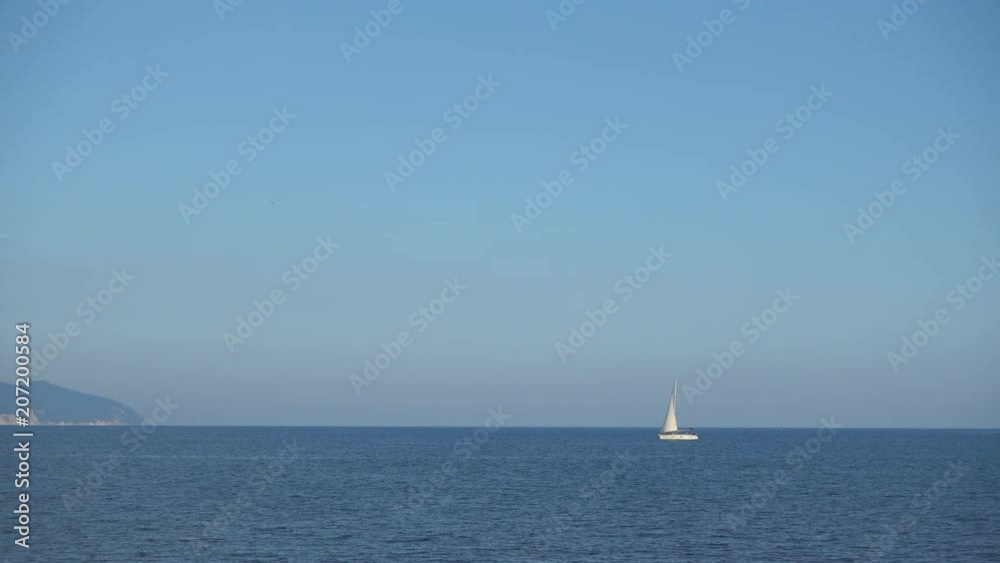 Beautiful sailing yacht floats on calm sea waves. Beautiful sailing yacht floats on calm sea waves.