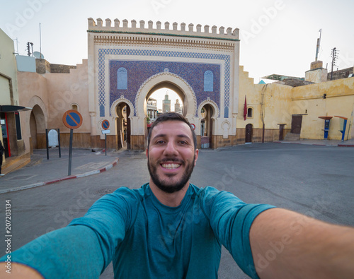 happy man tourist take selfie photo in Fez, Morocco photo