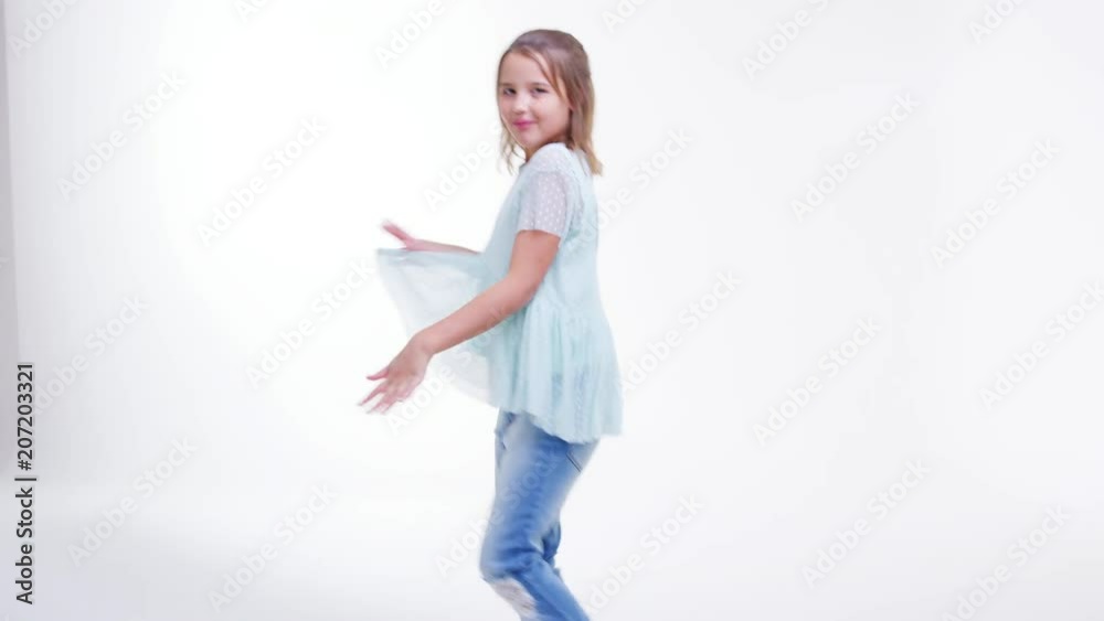 Young Girl Walking And Dancing Across Frame In Slow Motion Young Girl Walking And Dancing Across Frame In Slow Motion
