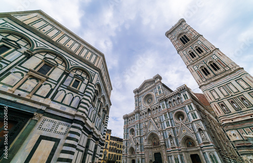 travel to Italy - Florence Baptistery (Battistero di San Giovanni, Baptistery of Saint John) and Duomo Cathedral Santa Maria del Fiore with Giotto's Campanile on Piazza San Giovanni in morning photo