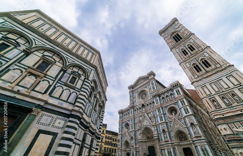 travel to Italy - Florence Baptistery (Battistero di San Giovanni, Baptistery of Saint John) and Duomo Cathedral Santa Maria del Fiore with Giotto's Campanile on Piazza San Giovanni in morning
