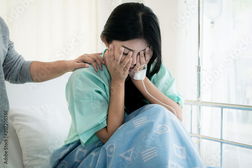 Asian young woman patient receiving bad news, Woman patient is desperate and crying. Her Mother support and comforting her patient with sympathy. photo