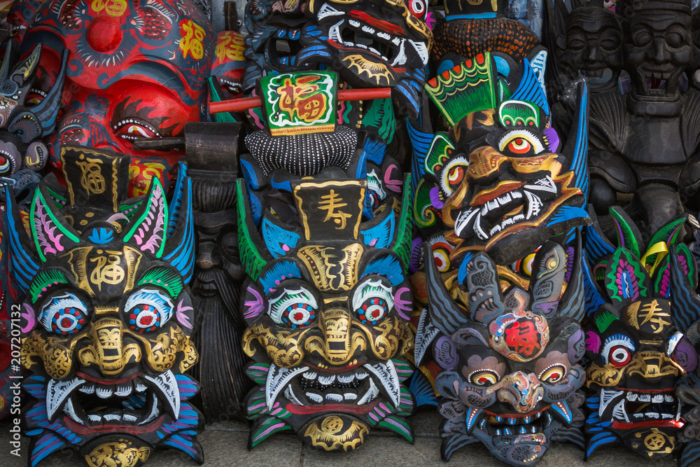 Chinese Wooden Masks Souvenirs in the market near the site of the Great Wall of China Mutianyu