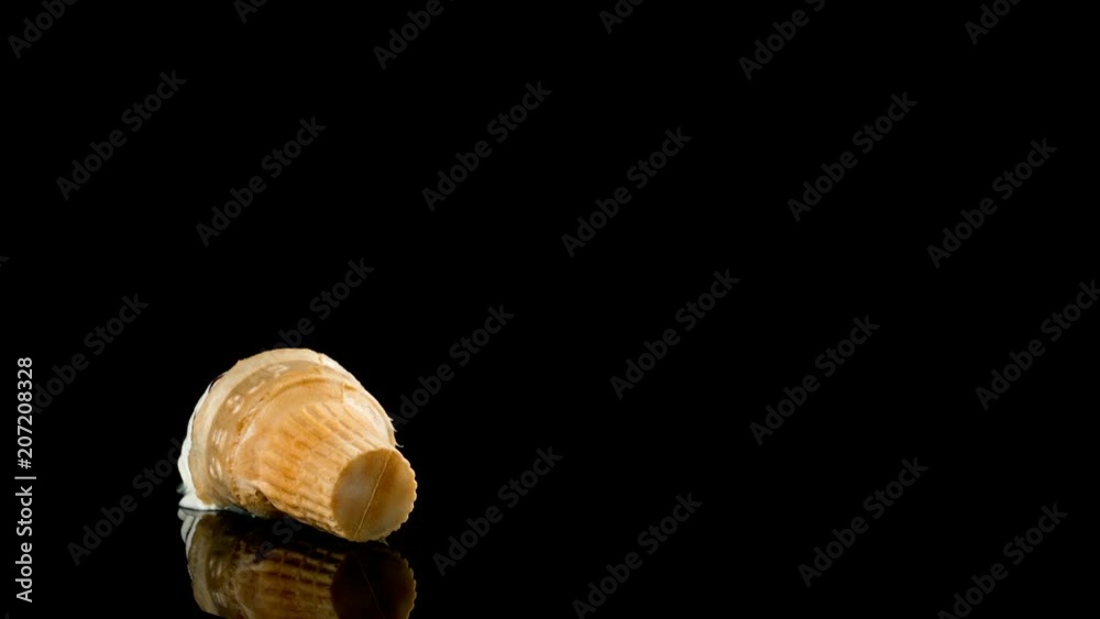 studio shoot of ice cream cone melting process on black background timelapse studio shoot of ice cream cone melting process on black background timelapse