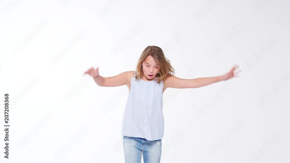 Girl Jumping Against White Studio Background Girl Jumping Against White Studio Background