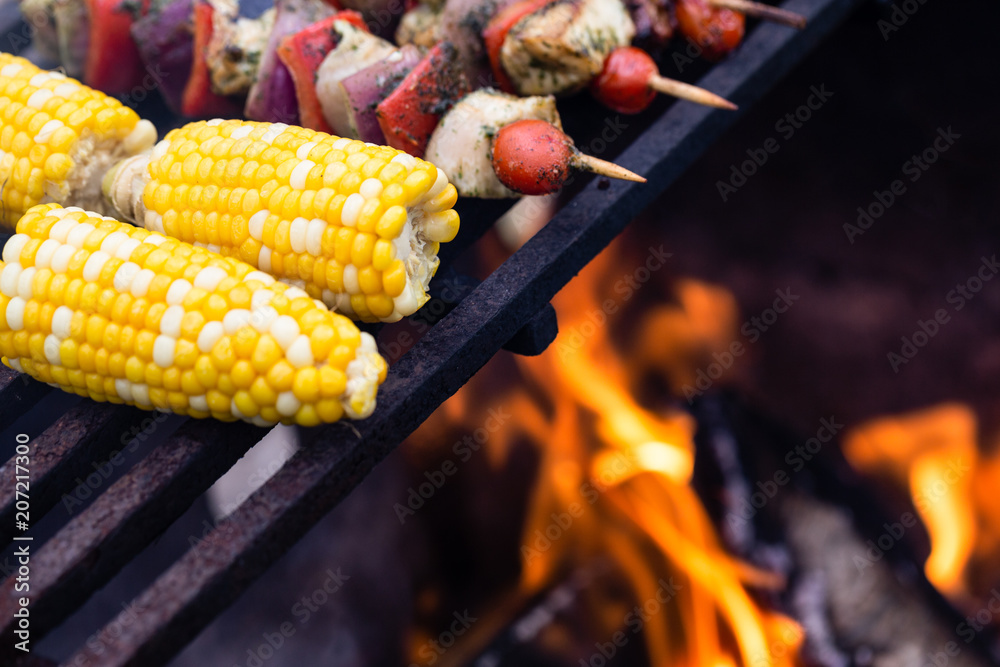 Corn and Kebabs on a Campfire Grill 