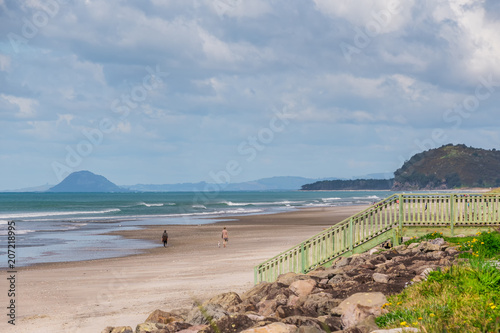 Walking the dog on the beach