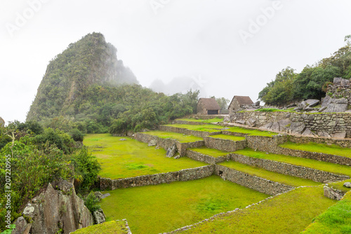 Northern side of Machu Picchu's citadel, with Huayna Picchu mountain in the back, in Peru