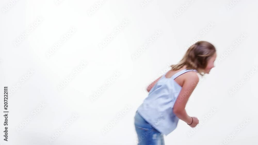 Girl Jumping Against White Studio Background Girl Jumping Against White Studio Background