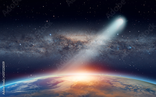 Bright comet approaching to The Sun in space  Elements of this image furnished by NASA. 