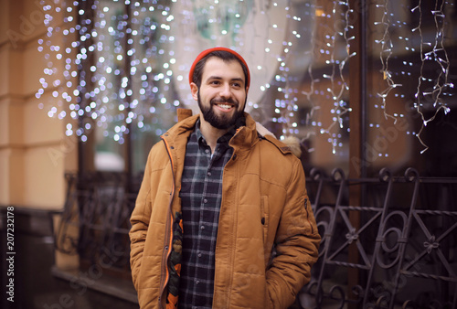 Handsome trendy hipster wal...