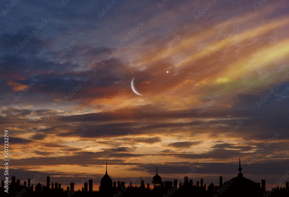  Crescent moon with beautiful sunset background . Generous Ramadan  . Dramatic nature background .  Sunset or sunrise with clouds, light rays and other atmospheric effect . Light from sky 