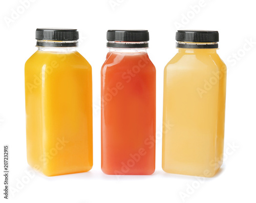 Bottles with fresh juices on white background