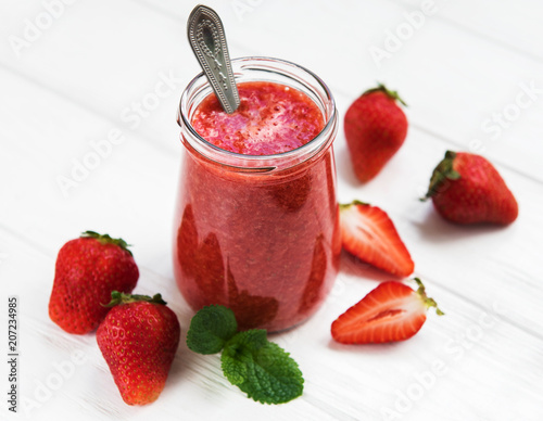 Jar with strawberry smoothie