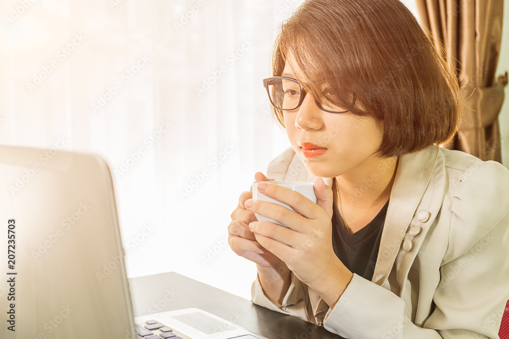 Woman teenage working on laptop in home office Woman teenage working on laptop in home office