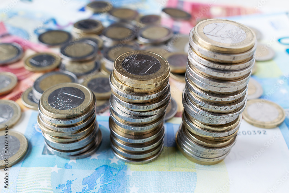 Financial growth concept with euro coins ladder on banknotes. european money Financial growth concept with euro coins ladder on banknotes. european money