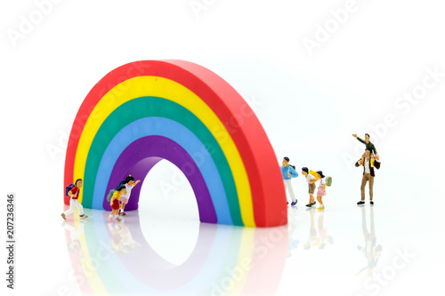 Miniature people : children and student playground in city park with rainbow background,Education,Play and learn concept.