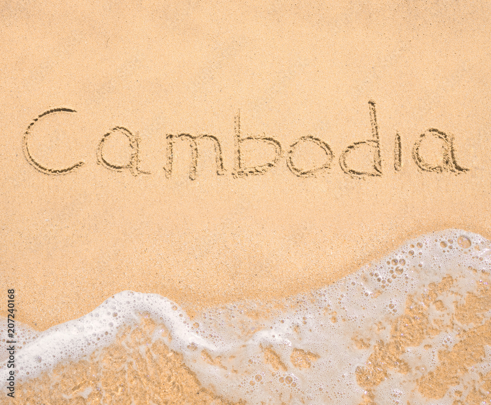 Fototapeta premium The word Cambodia written in the sand on beach