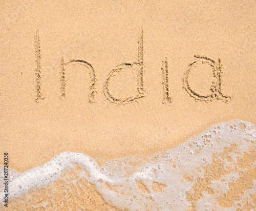 The word India written in the sand on beach © arttim