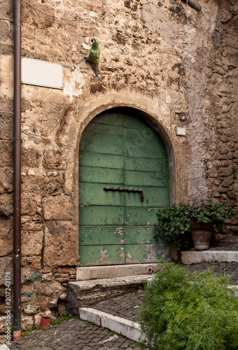 Fototapeta Naklejka Na Ścianę i Meble -  green door in ancient country