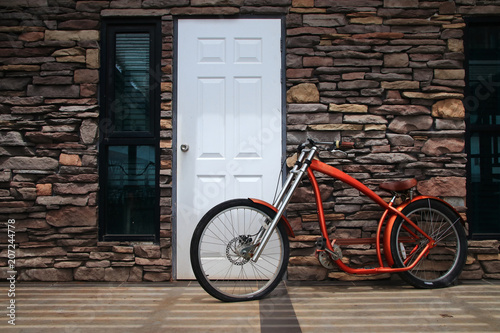 red biycle modern on stone wall background photo