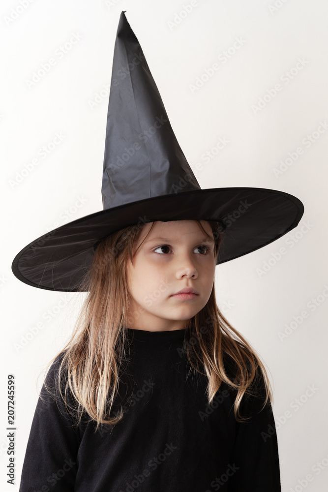 Girl in black witch costume close-up portrait Girl in black witch costume close-up portrait