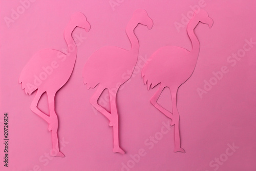 pink paper cut flamingo on a pink background