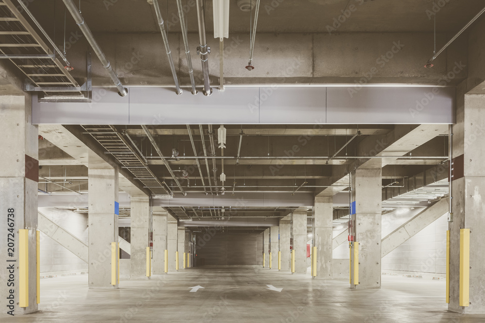 Parking garage underground interior, neon lights at night.. Parking garage underground interior, neon lights at night..