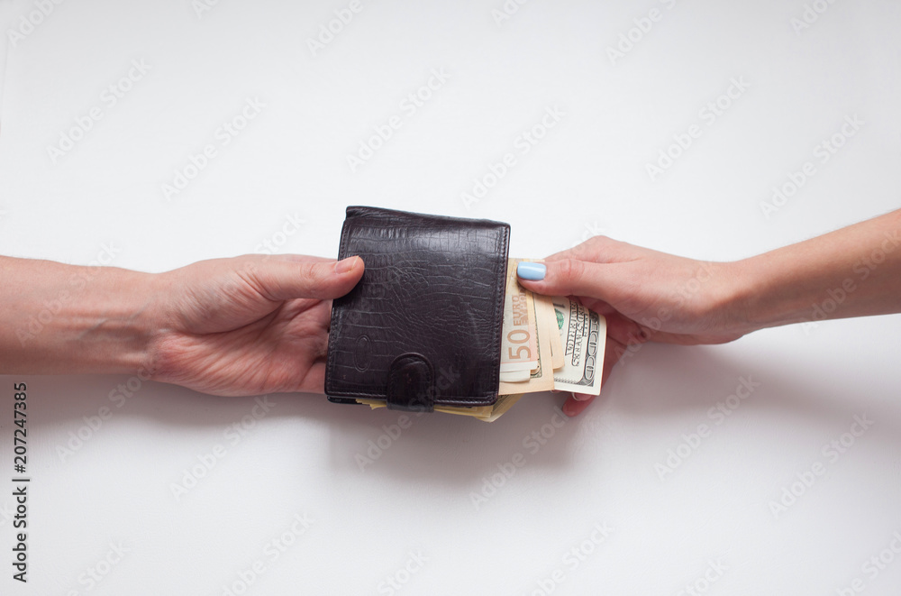 Woman gets money from the mens wallet. woman takes money Woman gets money from the mens wallet. woman takes money
