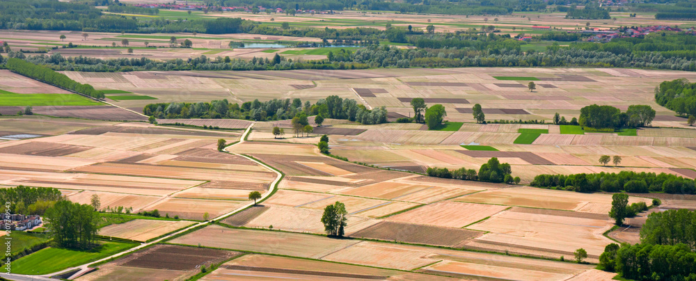 Obraz premium Panoramic view from above cultivated fields.