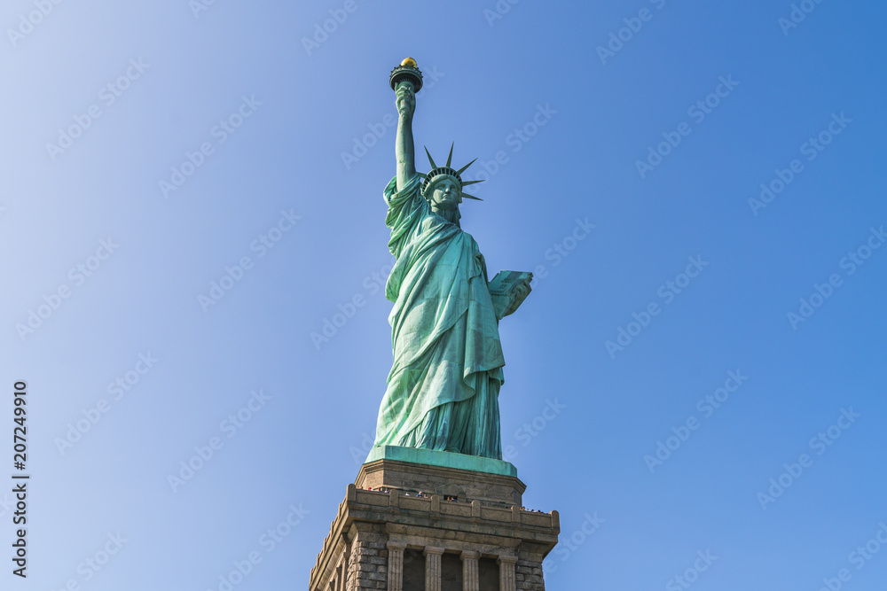 Fototapeta premium The statue of Liberty with blue sky background.
