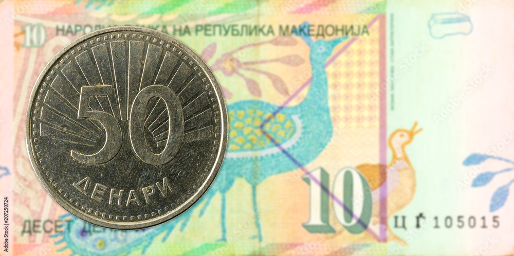 50 macedonian denar coin against 10 macedonian denar bank note 50 macedonian denar coin against 10 macedonian denar bank note