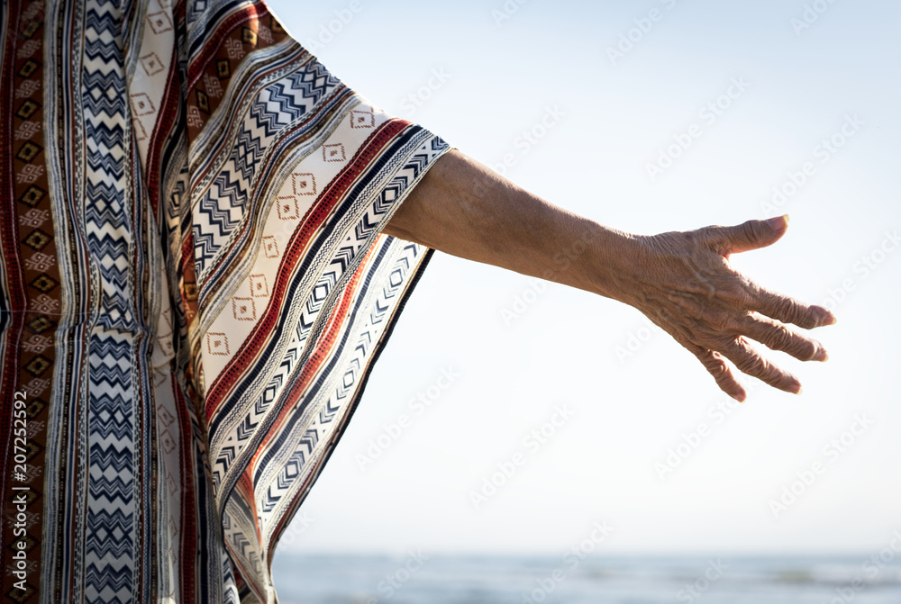 Senior woman reaching out her hand