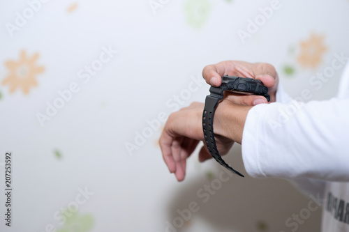 Hands and wrists black Digital time teller photo